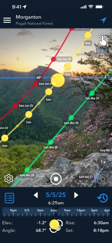 Lumos AR view: the sun's path for several dates drawn over a live camera view of a mountain landscape